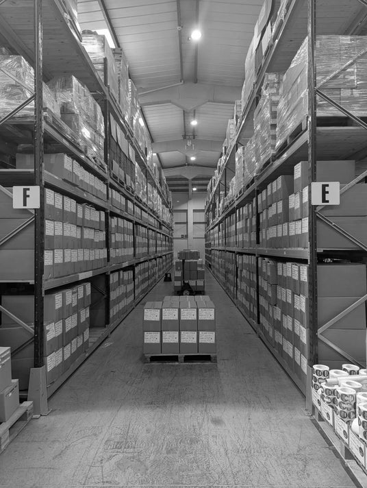 Black and white image of EDGE vaping stock ready for sale in a full warehouse