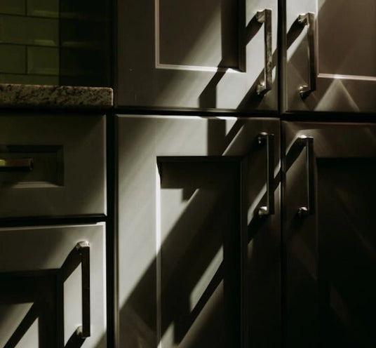 Sunlight shining on to a cupboard.