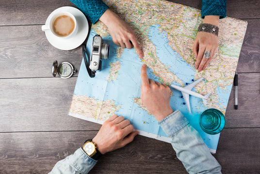 People pointing at a map stock image